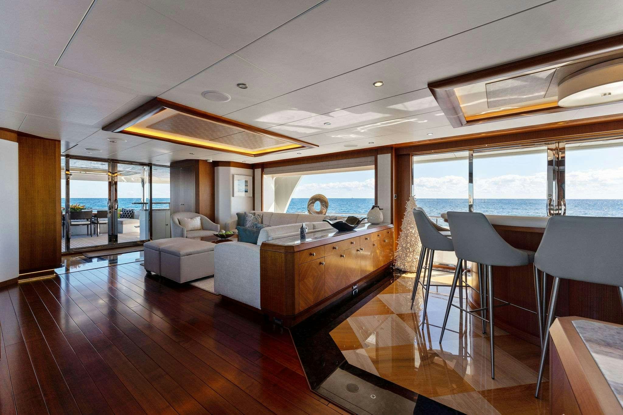 a room with a large window and a wood floor aboard LONG AWEIGHTED Yacht for Charter