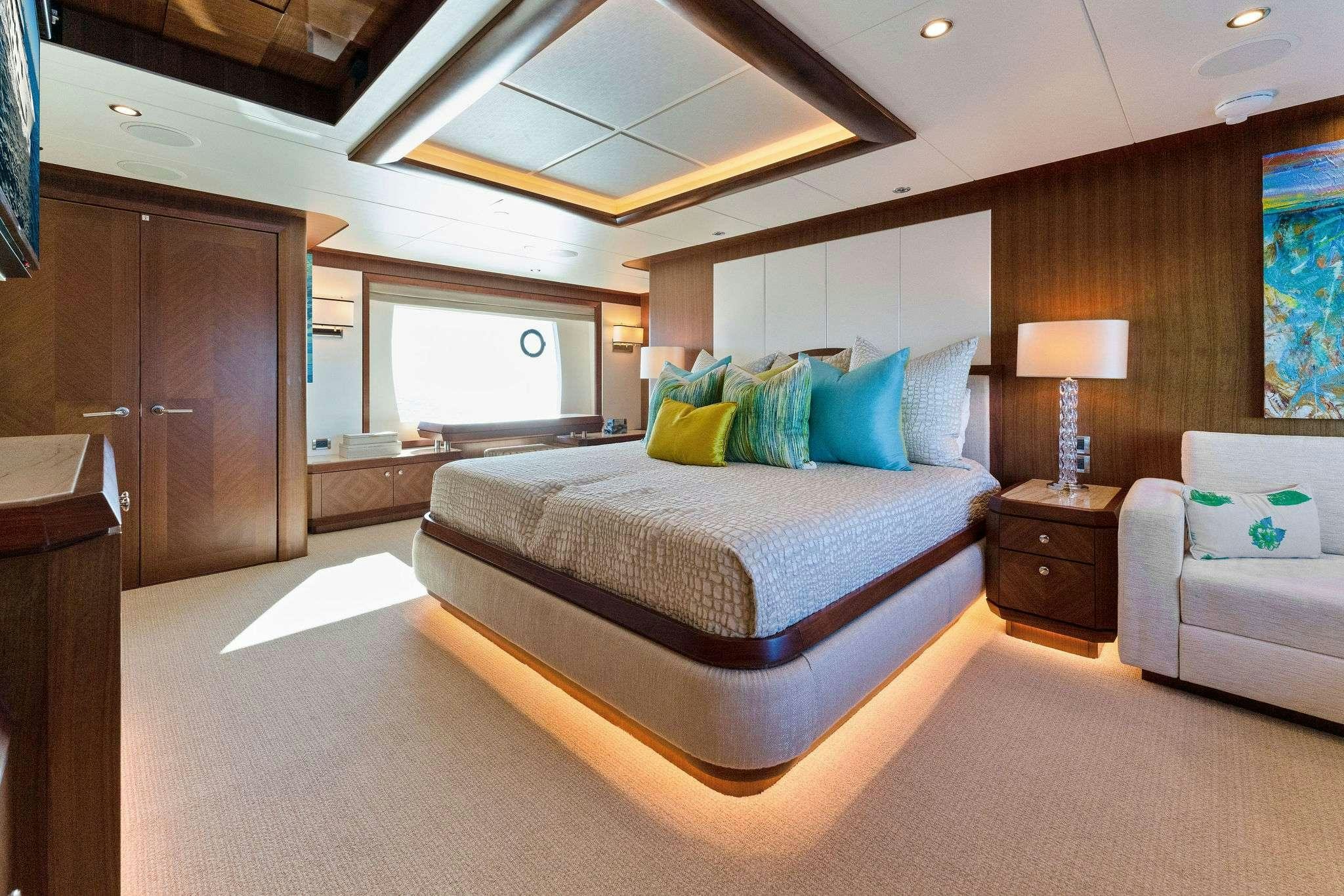 a large bedroom with a large bed aboard LONG AWEIGHTED Yacht for Charter