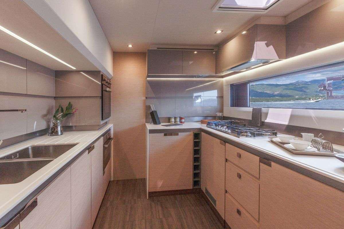a kitchen with a large window aboard STEPHANIE Yacht for Charter