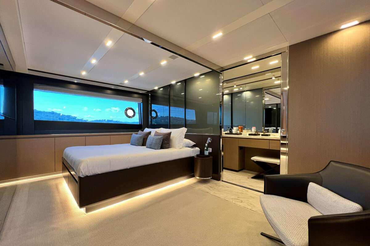 a room with a bed and a tv aboard KAR Yacht for Charter