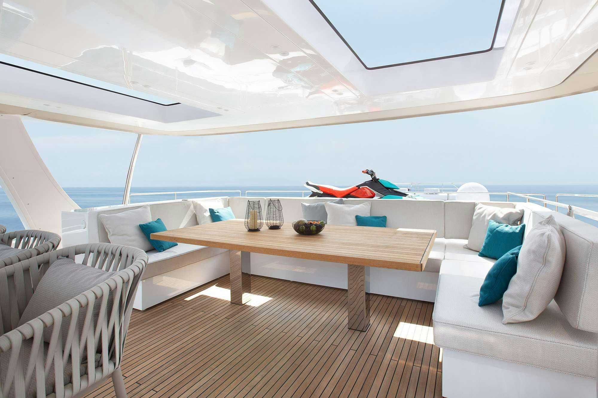 a room with a table and chairs aboard ENTRE4 Yacht for Charter