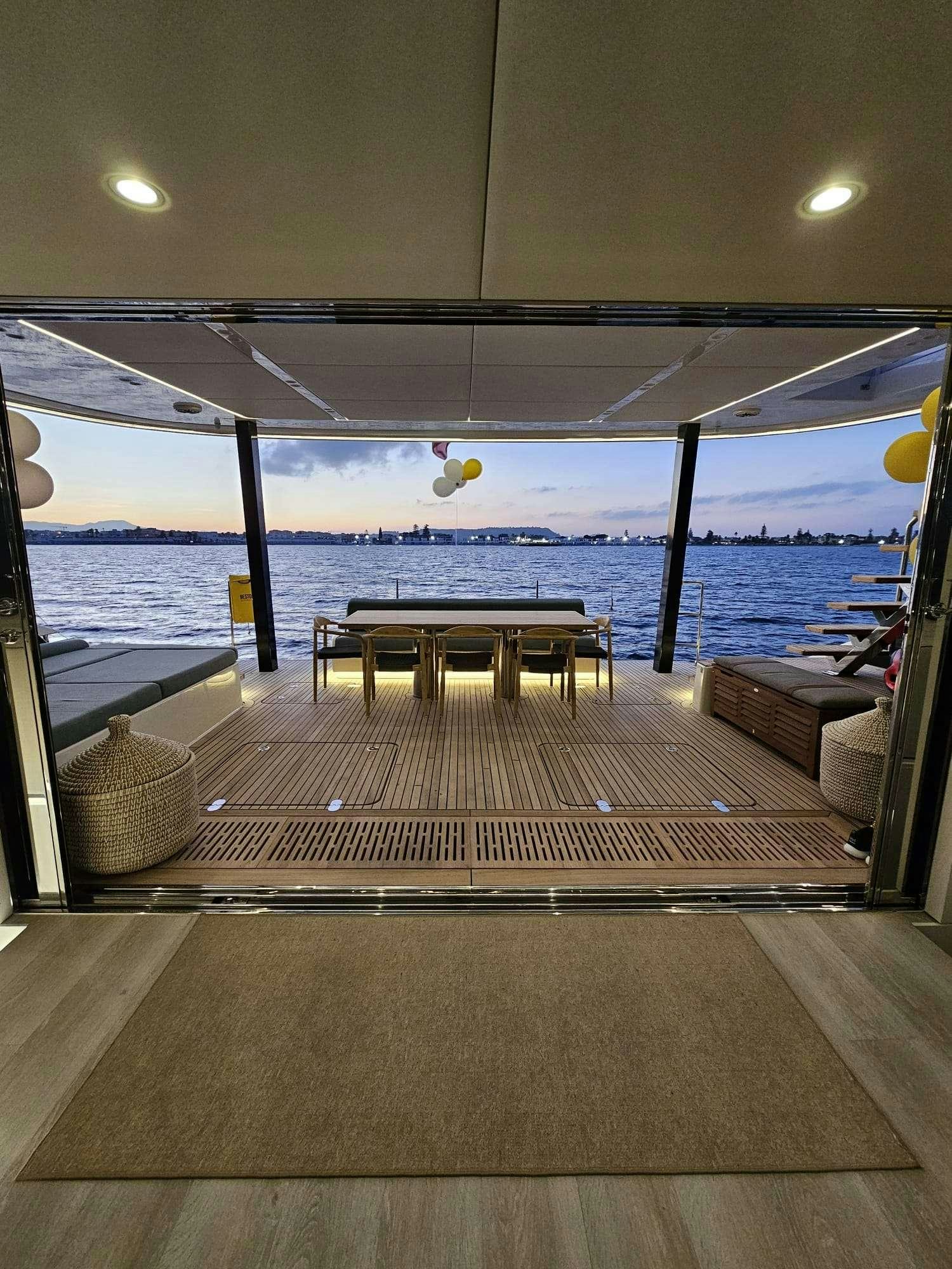 a room with a table and chairs aboard ENTRE4 Yacht for Charter