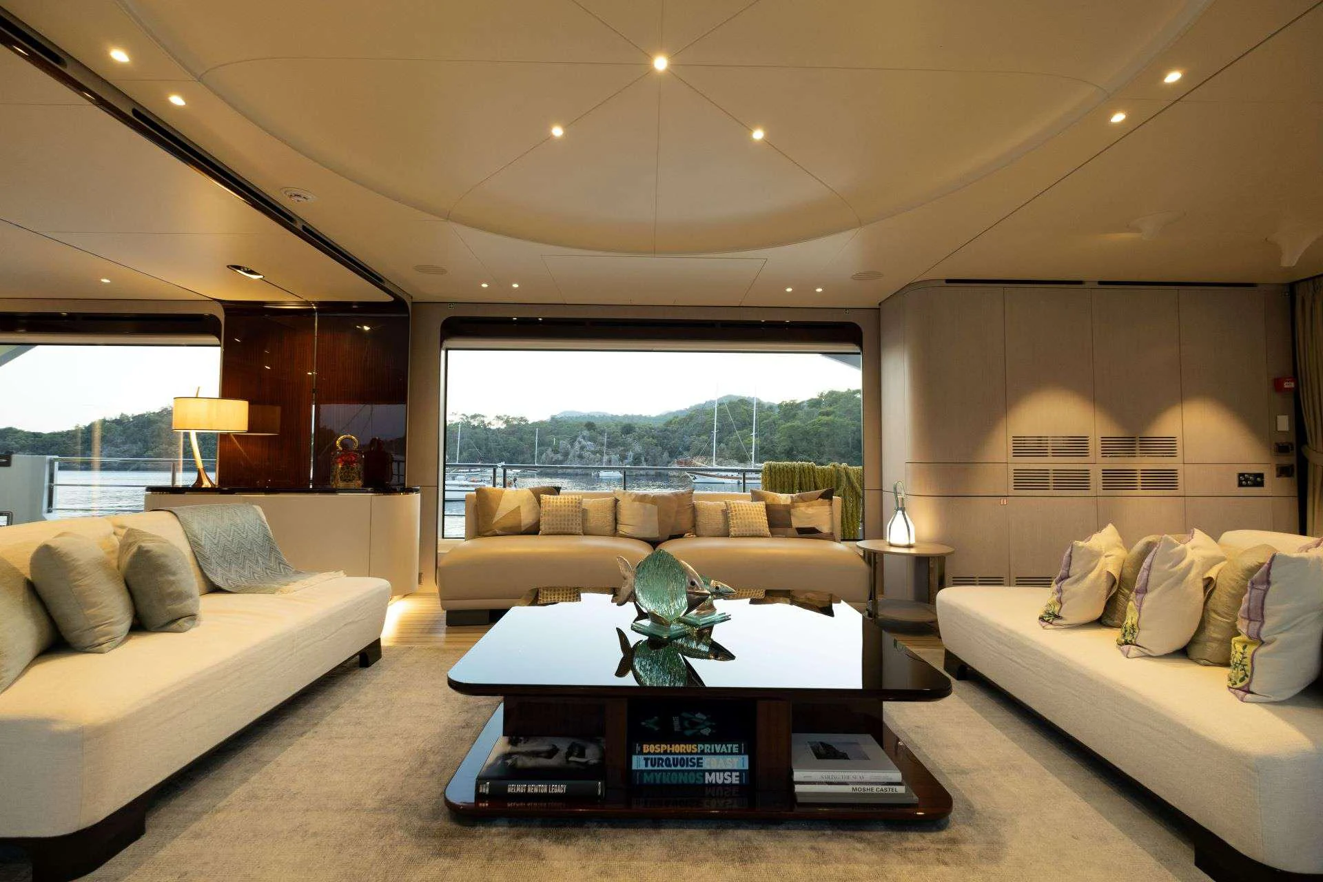 a living room with a couch and a coffee table aboard 116 YACHT Yacht for Charter