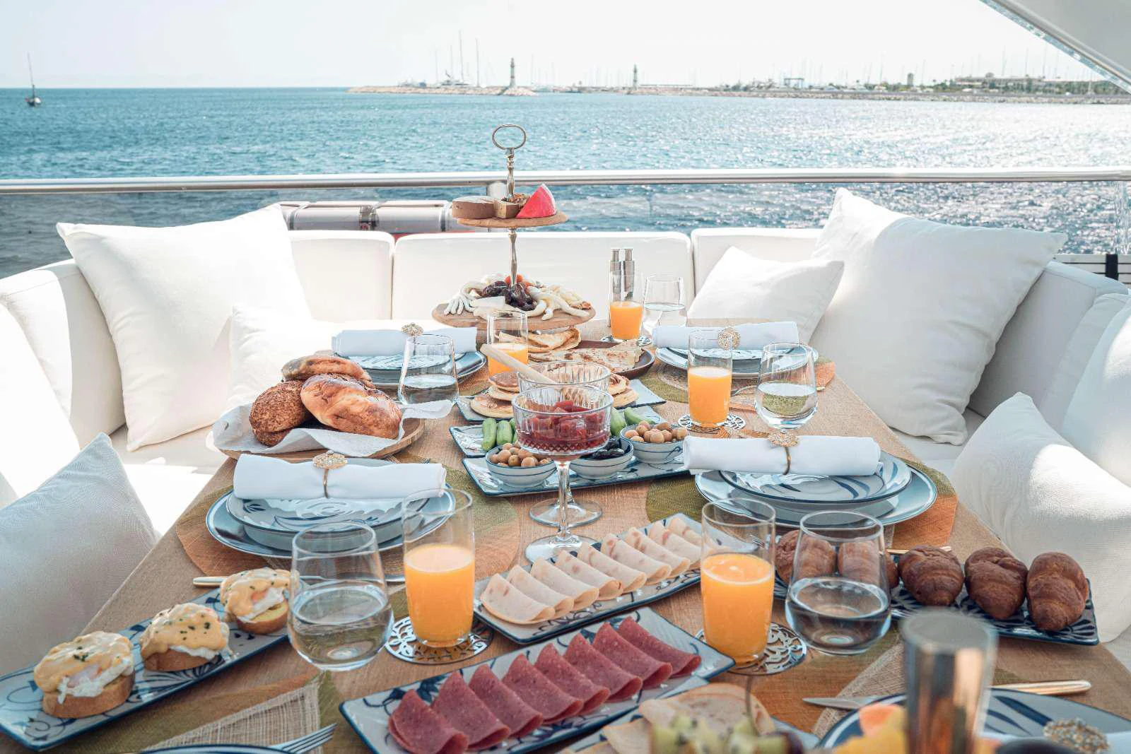 a table with food and drinks on it aboard 116 YACHT Yacht for Charter