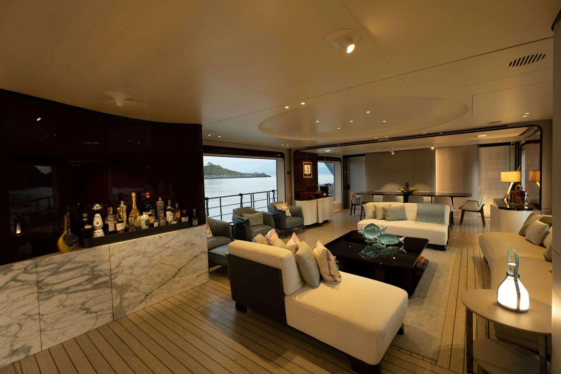 a living room with a large window aboard 116 YACHT Yacht for Charter