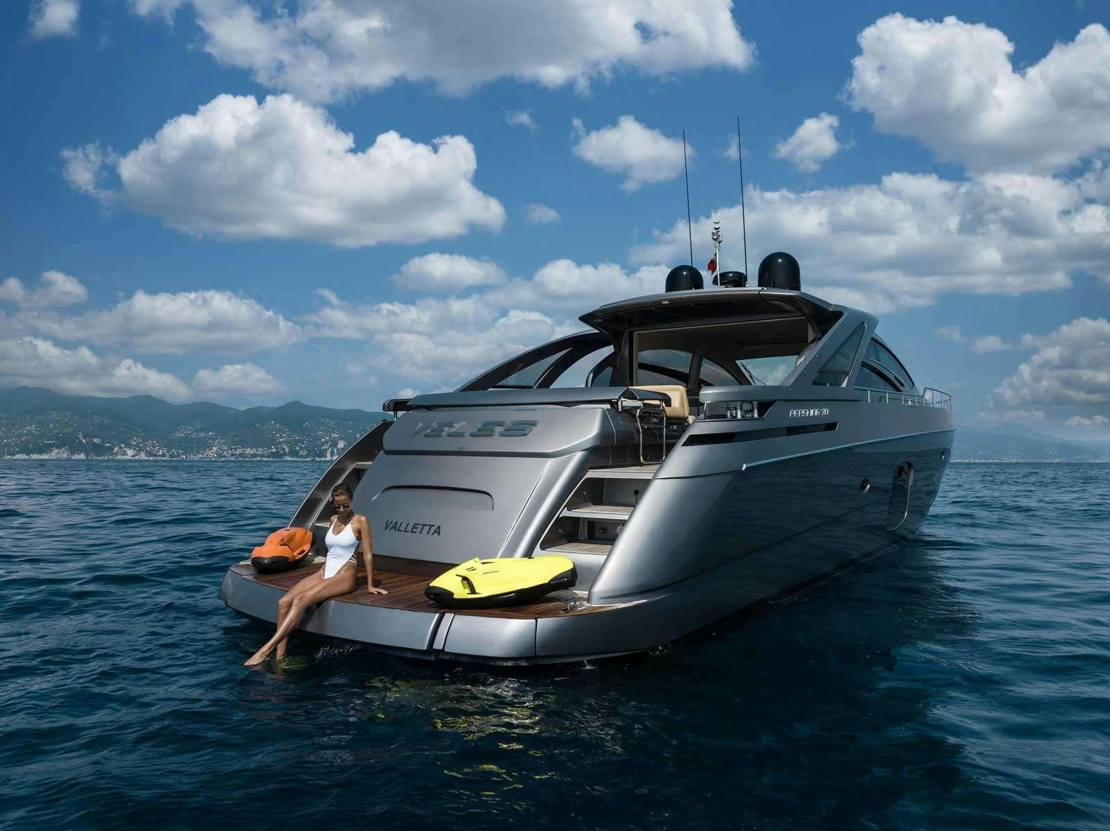 a man and a woman on a boat in the water aboard VELES Yacht for Charter