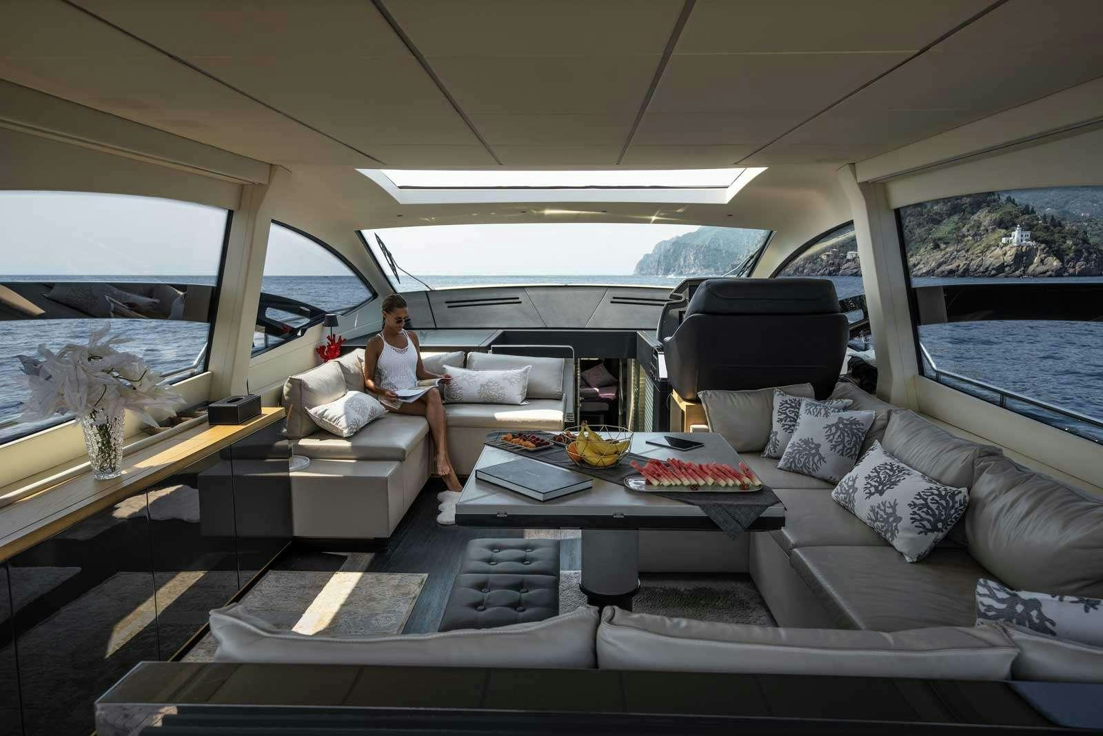 a person sitting on a couch in a car aboard VELES Yacht for Charter