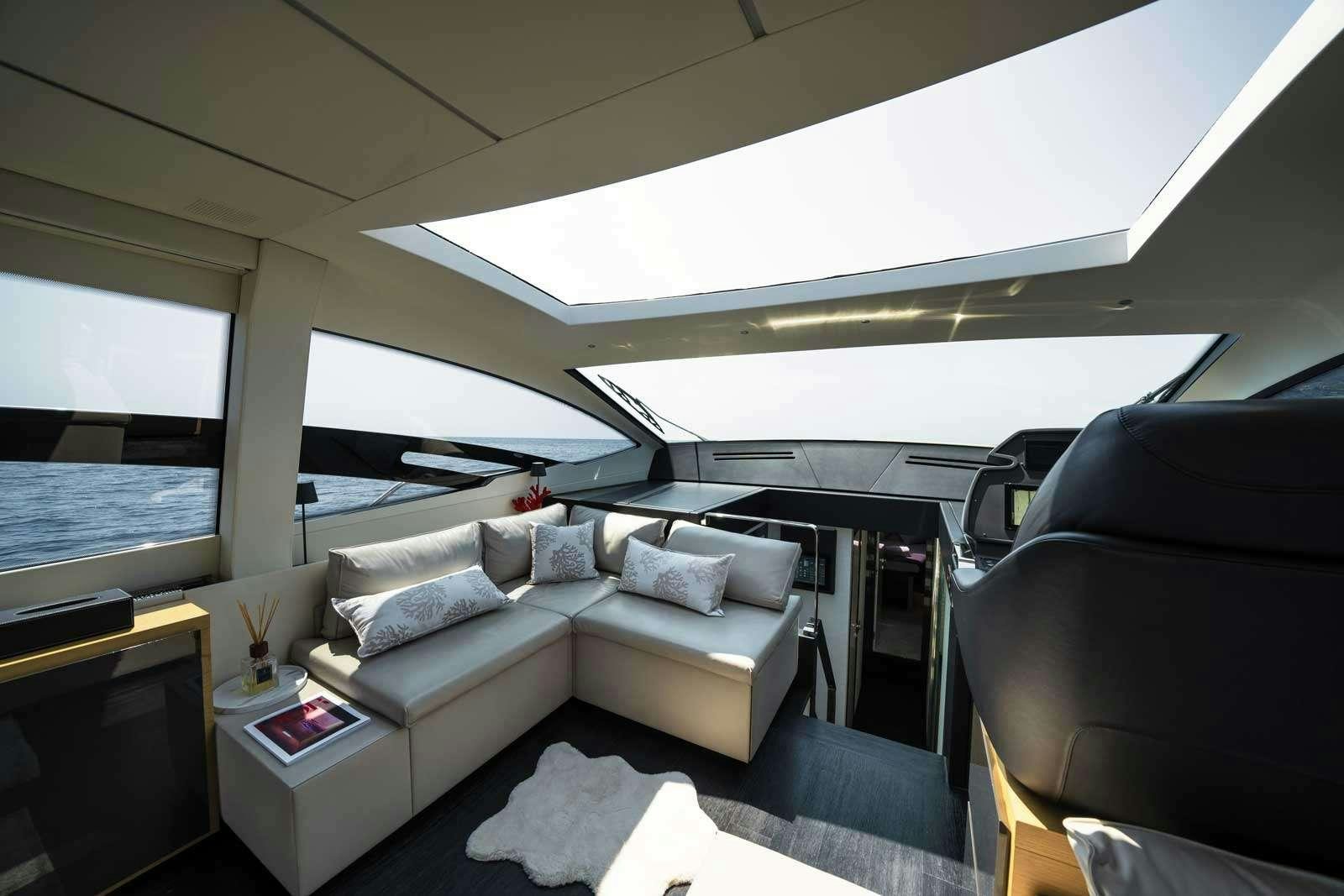 a room with a couch and a table aboard VELES Yacht for Charter