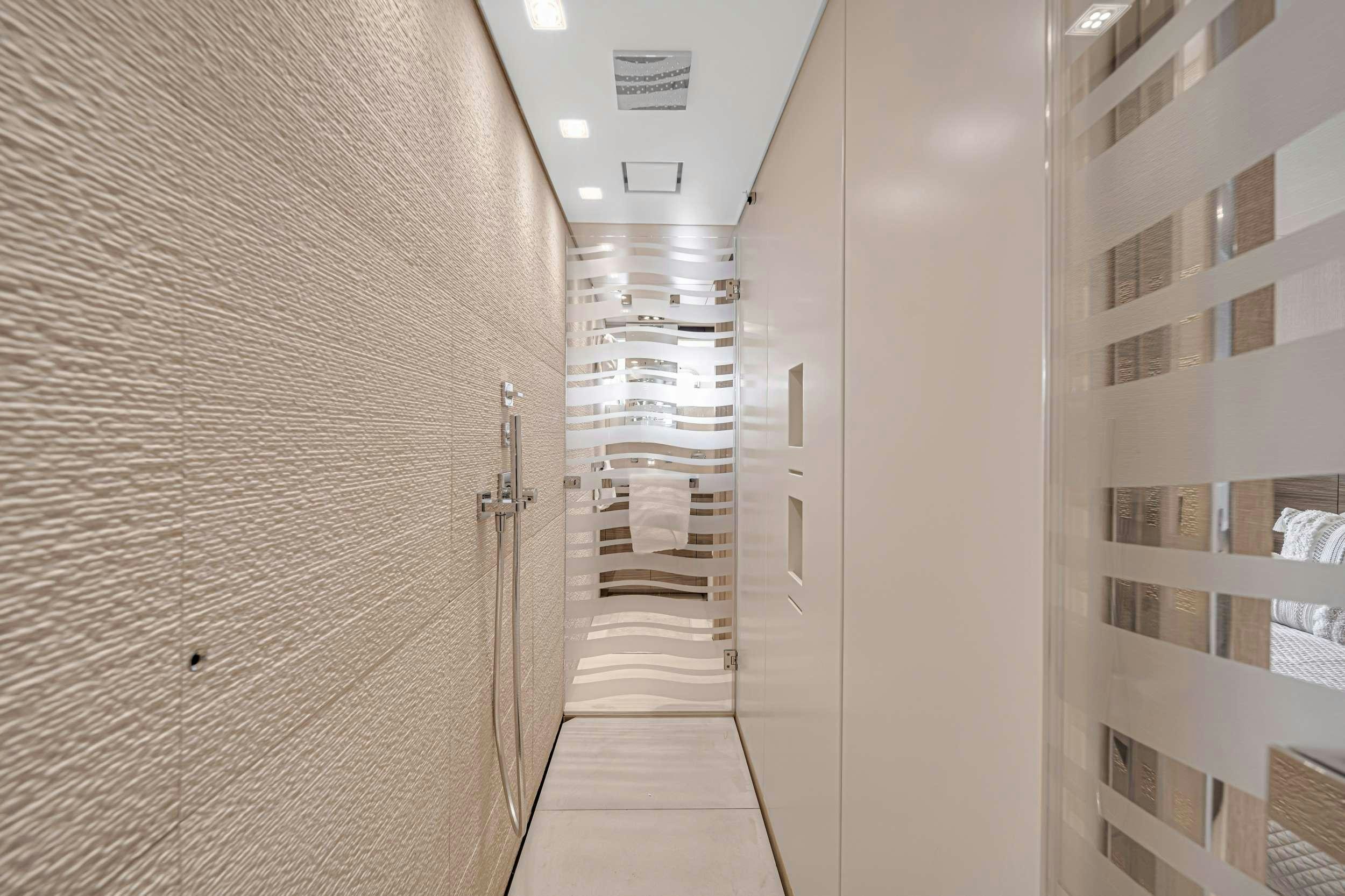 a hallway with white walls aboard ASTONISH Yacht for Charter