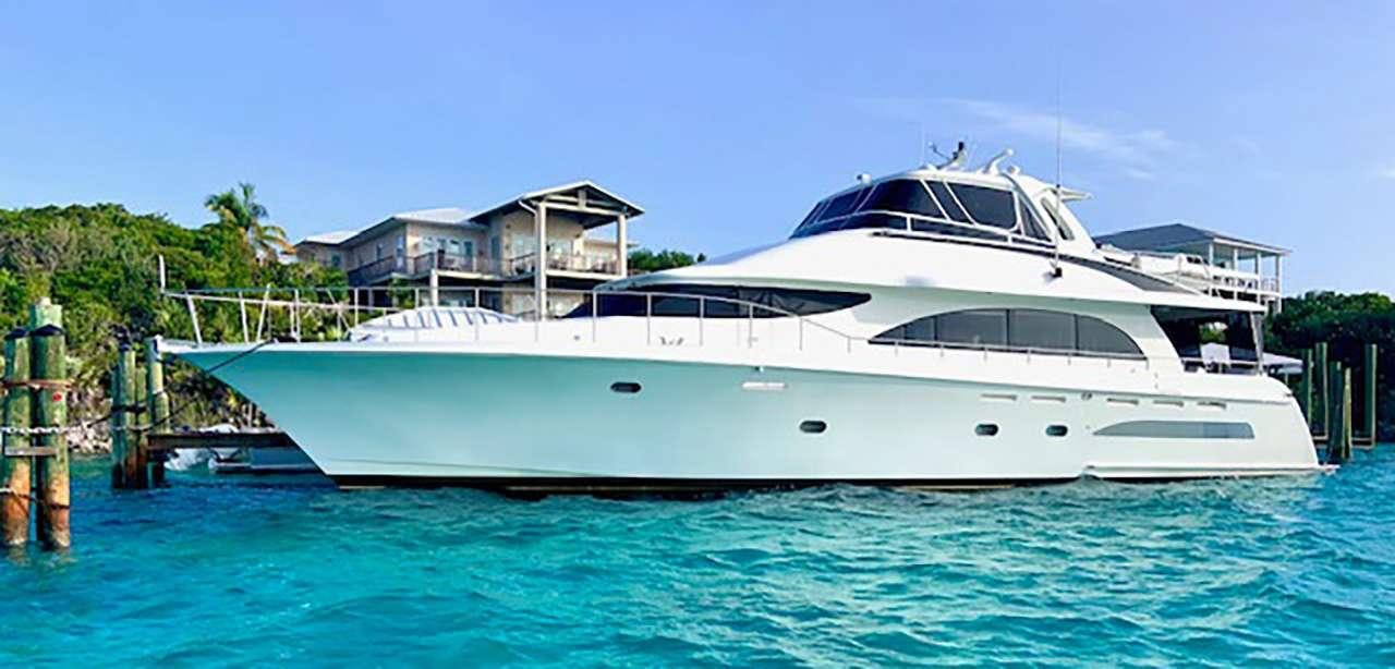 a white yacht in a body of water aboard CHASER Yacht for Charter