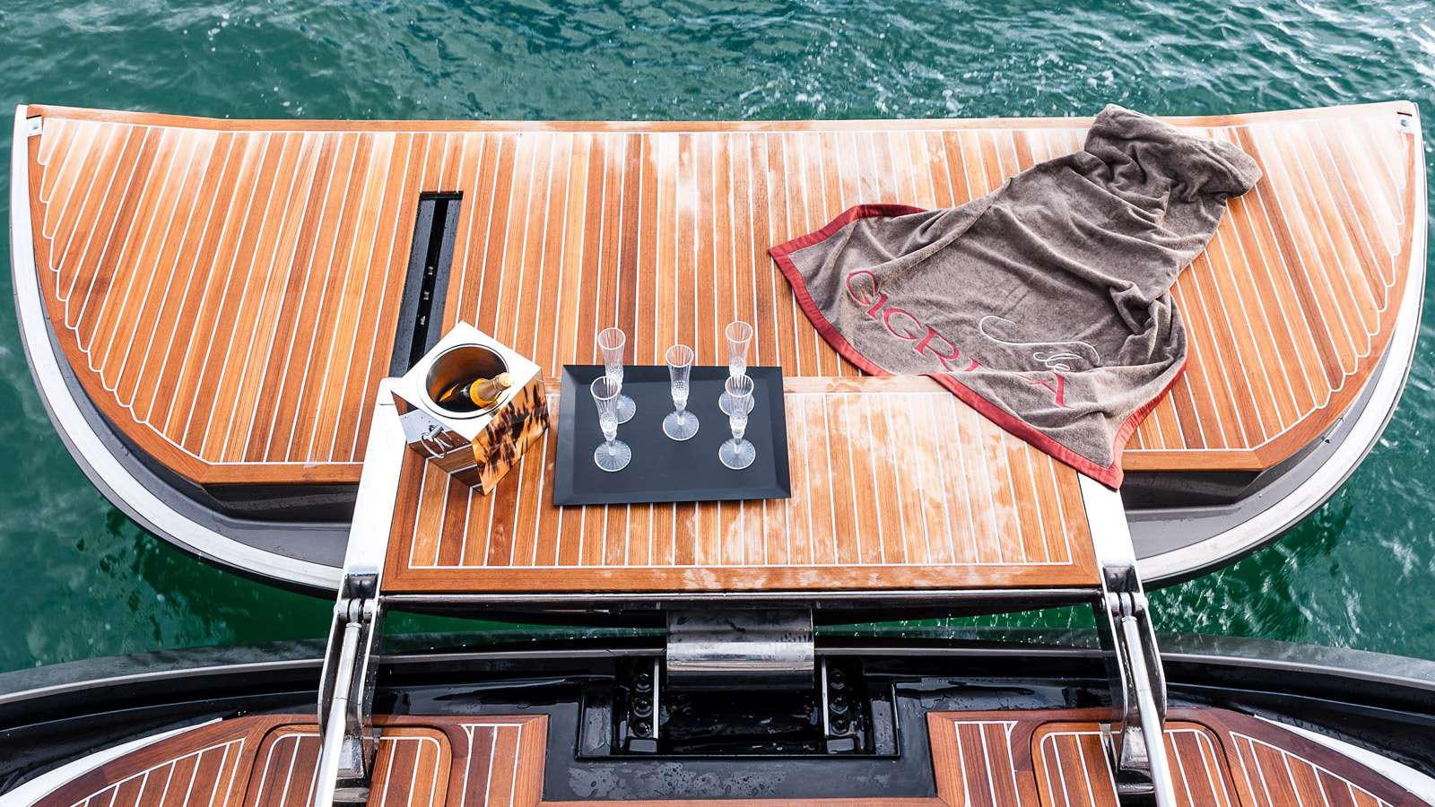 a boat with a table and chairs aboard GIGRECA Yacht for Charter