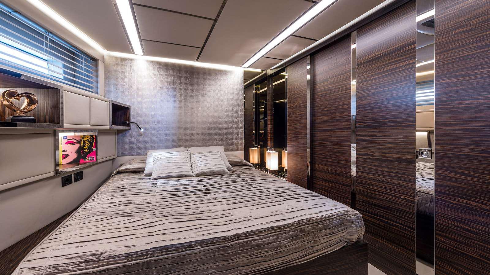 a bed in a room aboard GIGRECA Yacht for Charter