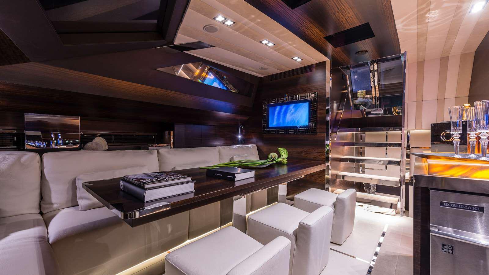 a room with a couch and a tv aboard GIGRECA Yacht for Charter