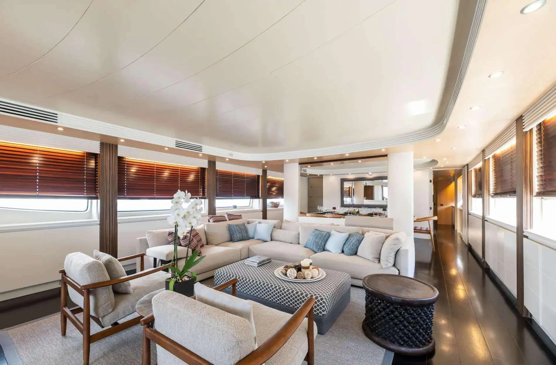 a living room with a couch and a table aboard PAREAKI II Yacht for Charter
