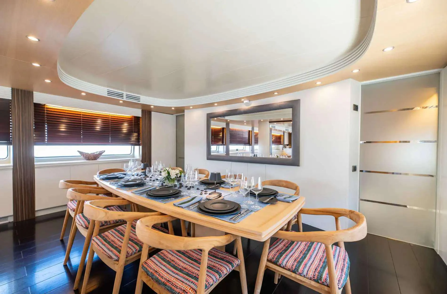 a dining table and chairs in a room aboard PAREAKI II Yacht for Charter