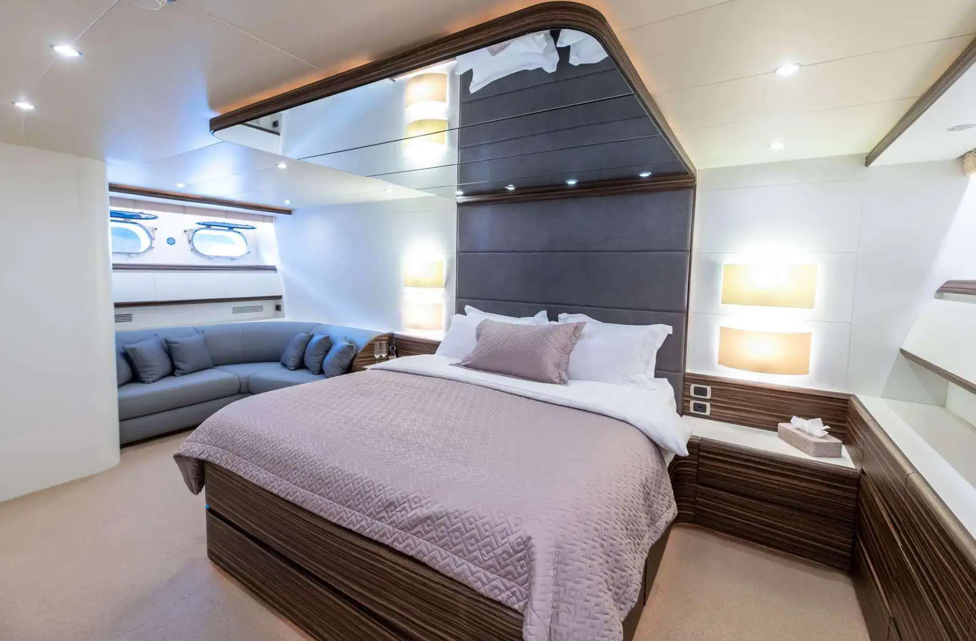 a large bed in a room aboard PAREAKI II Yacht for Charter