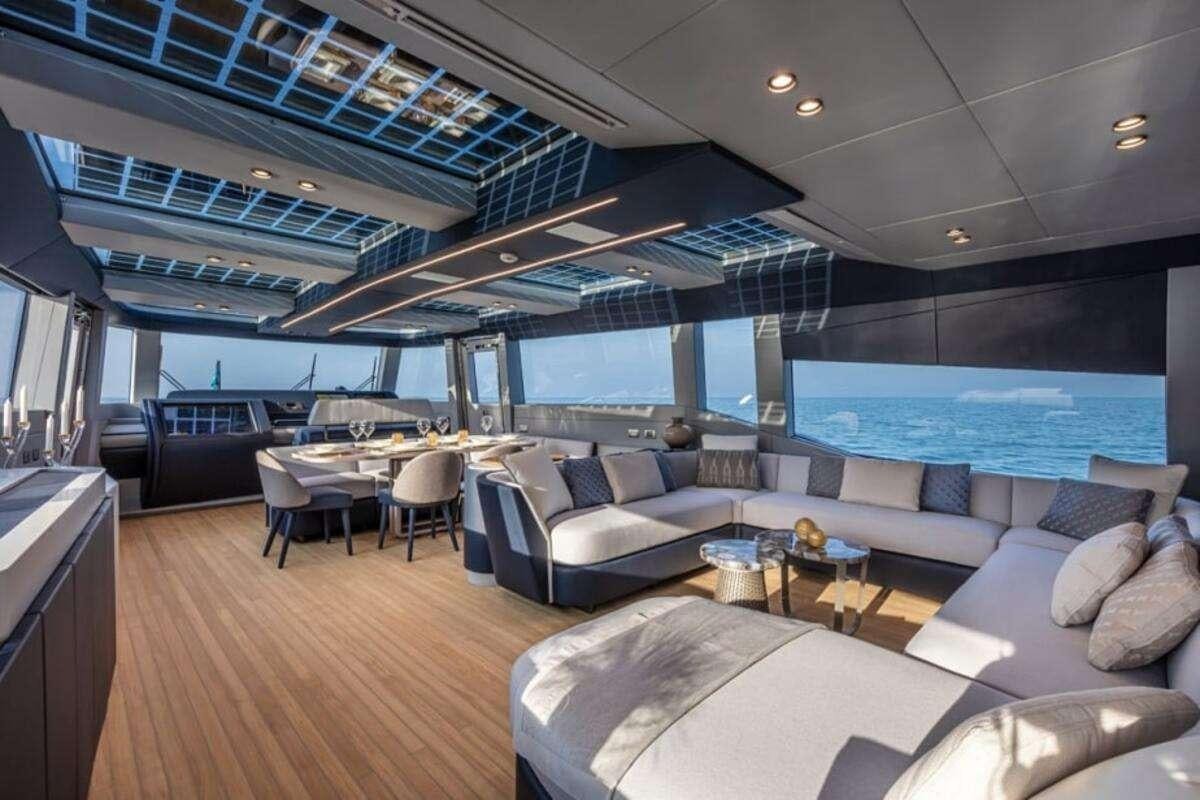 a living room with a large window aboard 86 YACHT Yacht for Charter