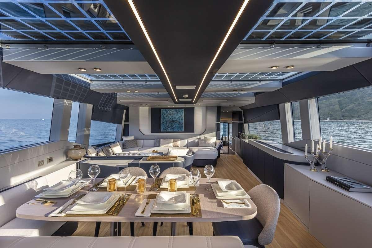 a large room with a table and chairs aboard 86 YACHT Yacht for Charter