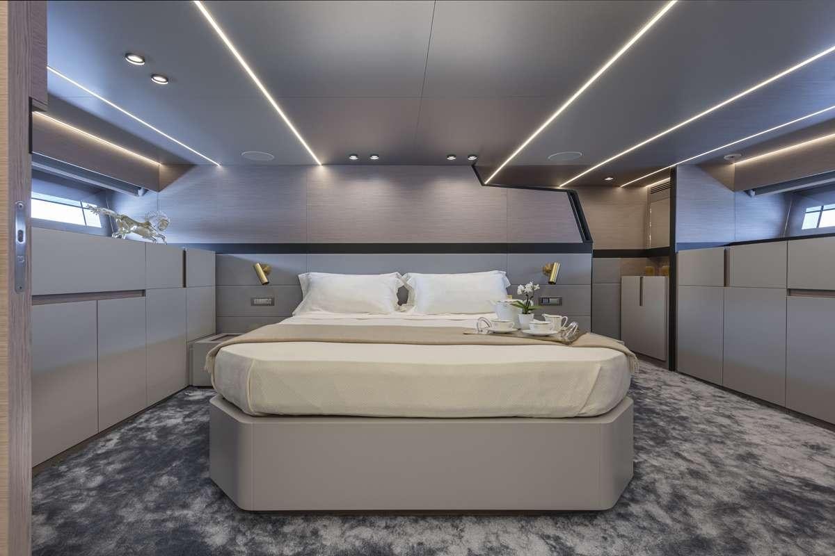 a white bed in a room aboard 86 YACHT Yacht for Charter