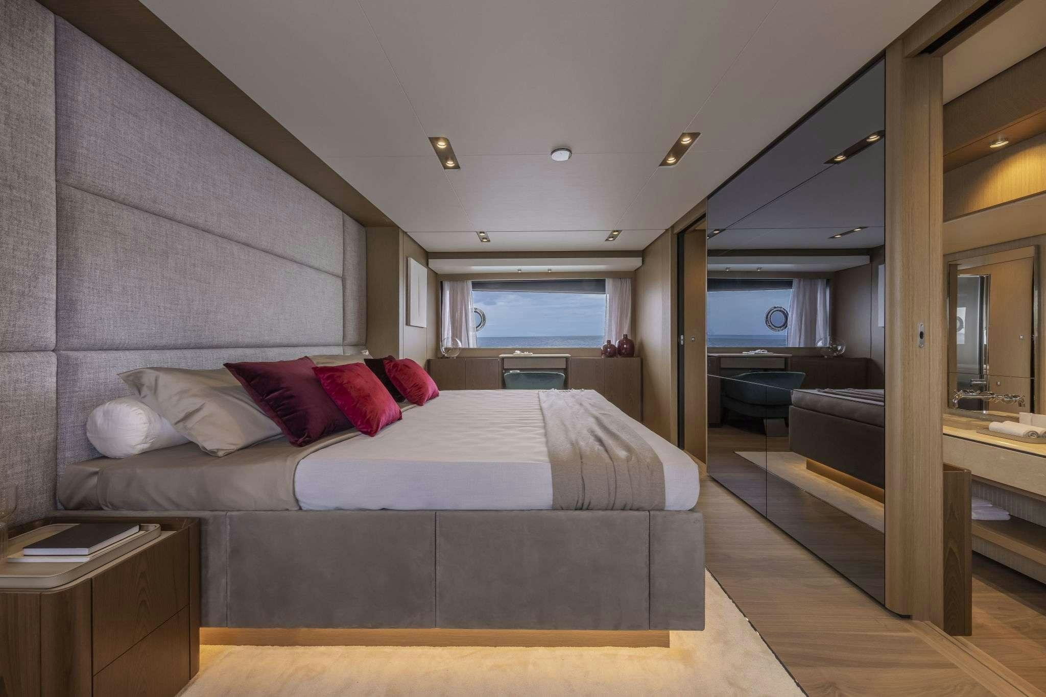 a bed in a room aboard B.A.13 Yacht for Charter