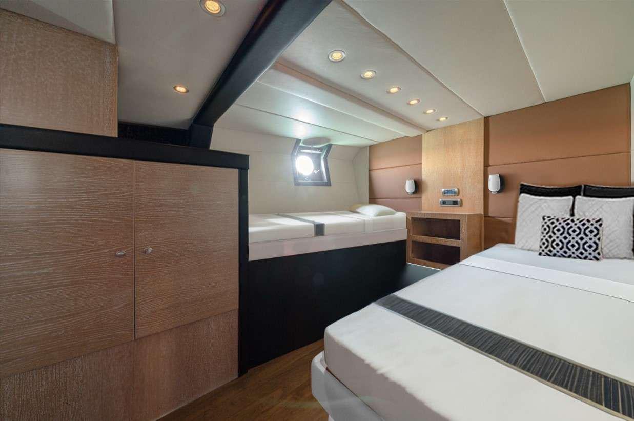 a room with two beds aboard GEMAYA Yacht for Charter