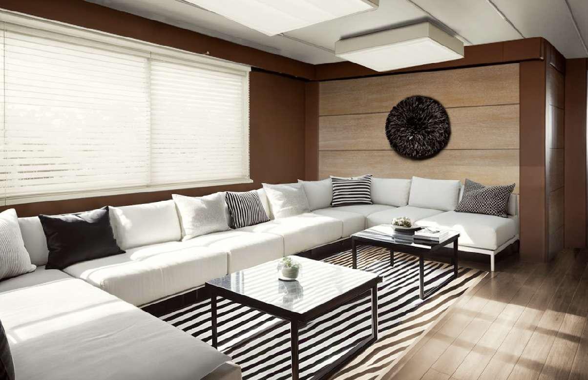 a room with a couch and a table aboard GEMAYA Yacht for Charter
