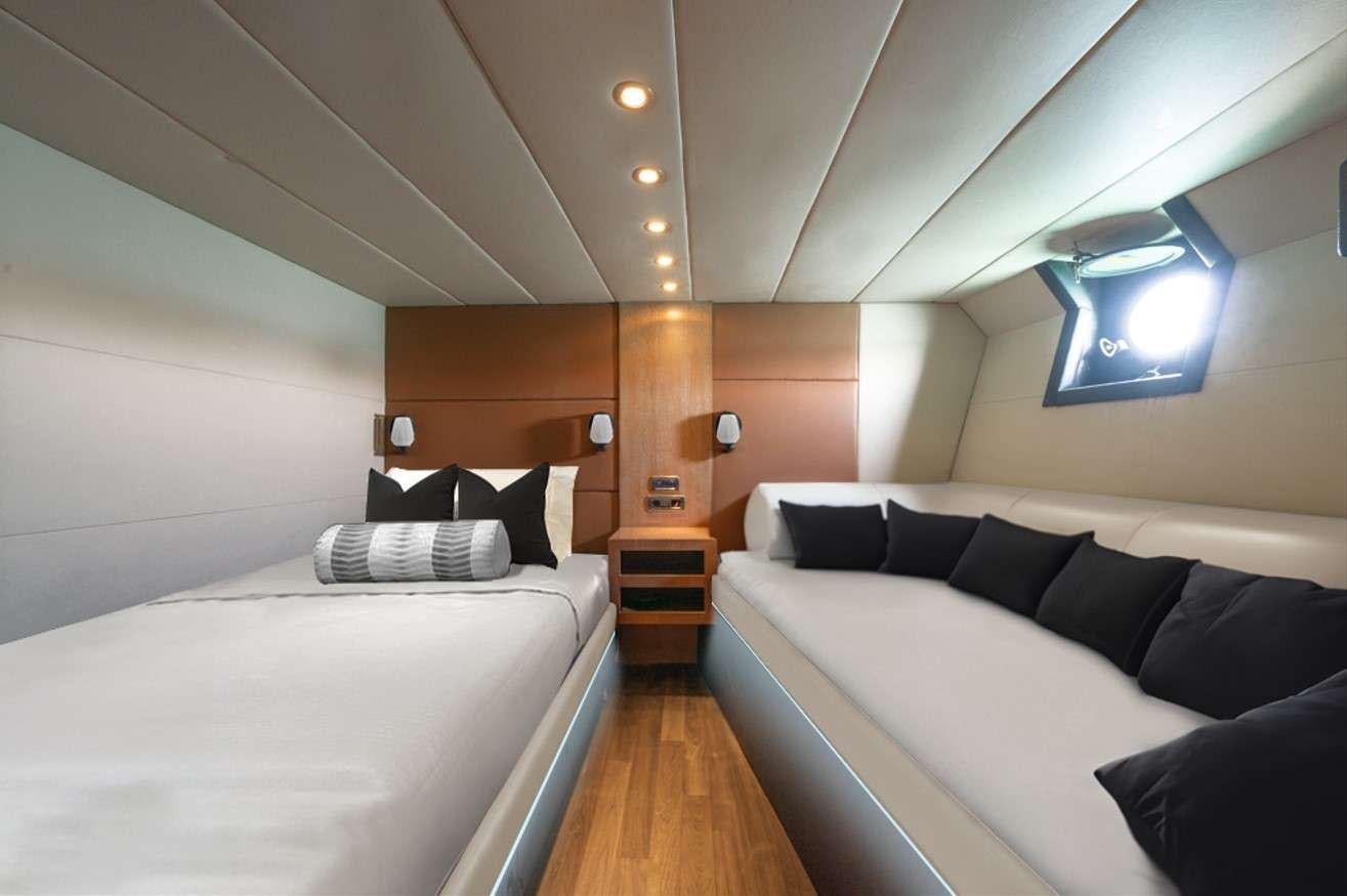 a room with two beds aboard GEMAYA Yacht for Charter