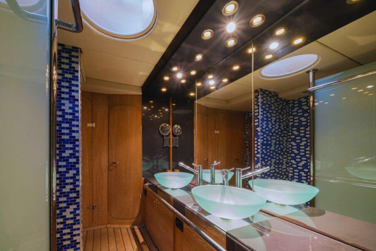 a bathroom with sinks and mirrors aboard GEMAYA Yacht for Charter