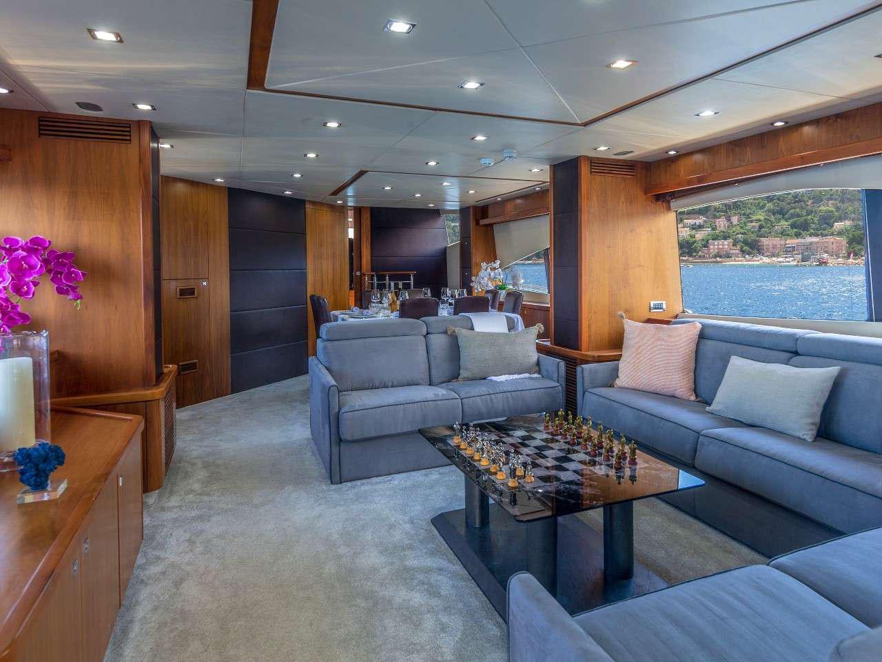 a living room with a couch and a table aboard MR SEA Yacht for Charter