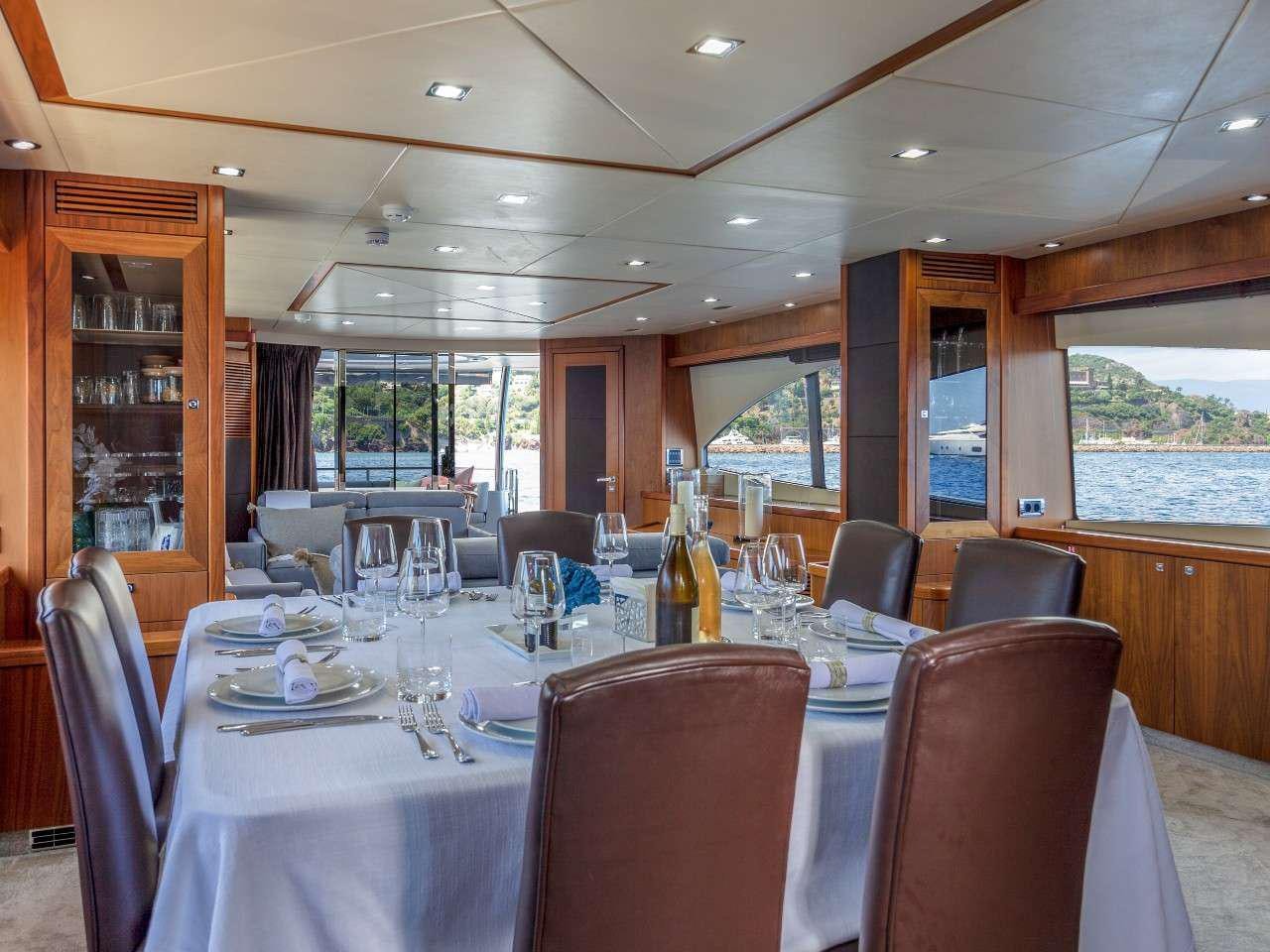 a table set for a dinner aboard MR SEA Yacht for Charter