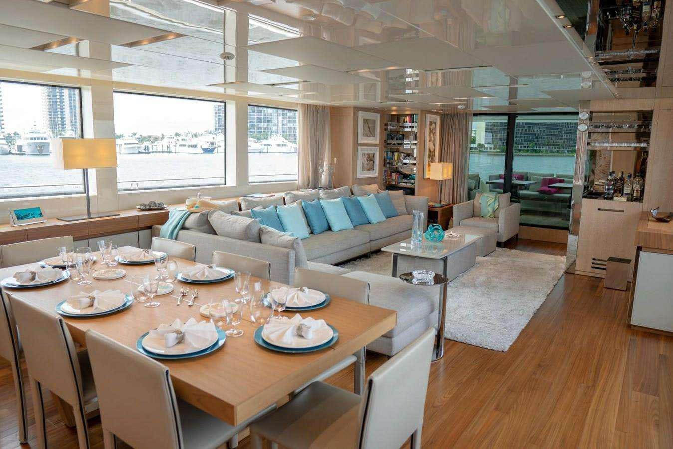 a large dining room with a large window aboard GOLDEN YACHT Yacht for Charter