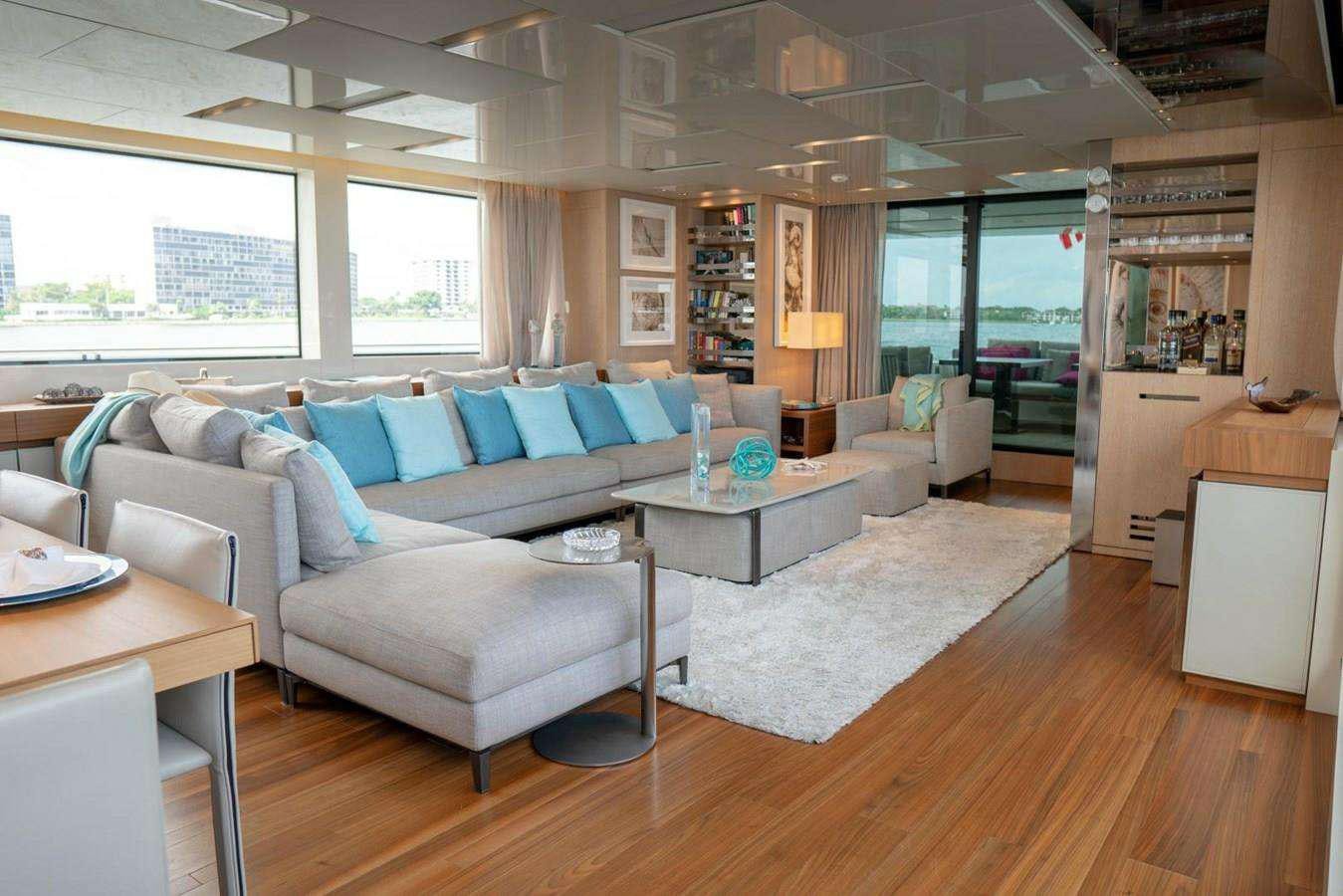 a living room with a couch and a table aboard GOLDEN YACHT Yacht for Charter
