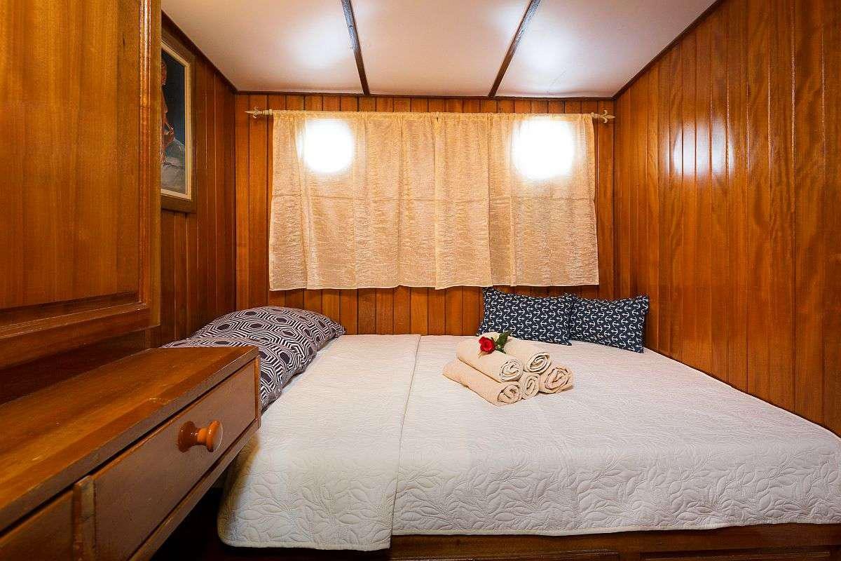 a bedroom with two beds aboard GIDEON Yacht for Charter
