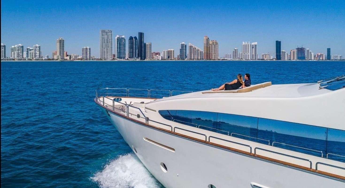 a person sitting on a boat aboard RYLAX Yacht for Charter