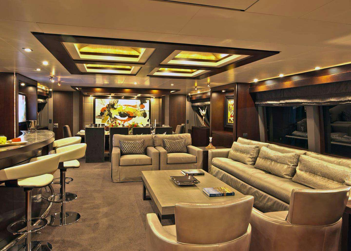a room with couches and tables aboard RYLAX Yacht for Charter