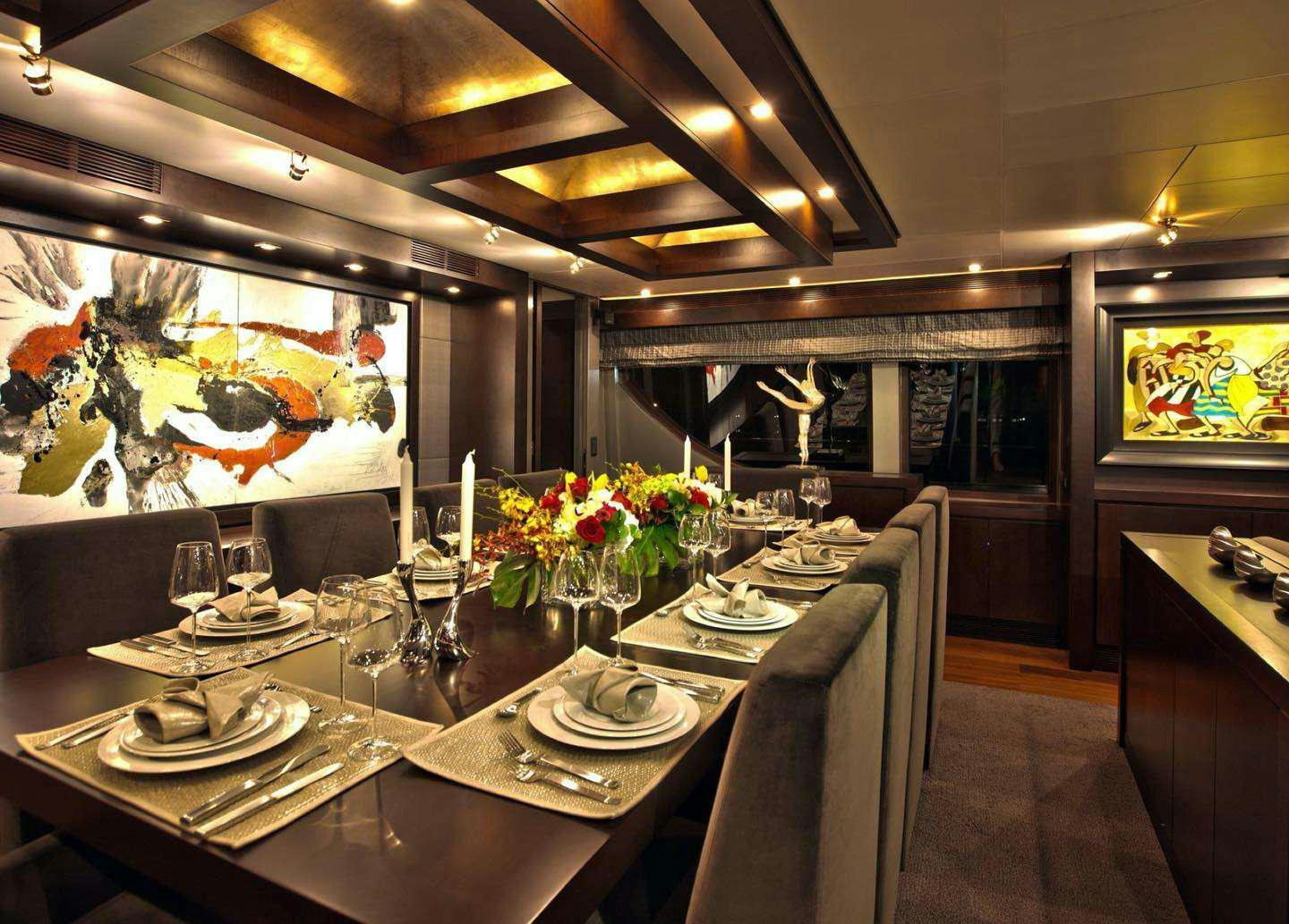 a dining room with a table set aboard RYLAX Yacht for Charter
