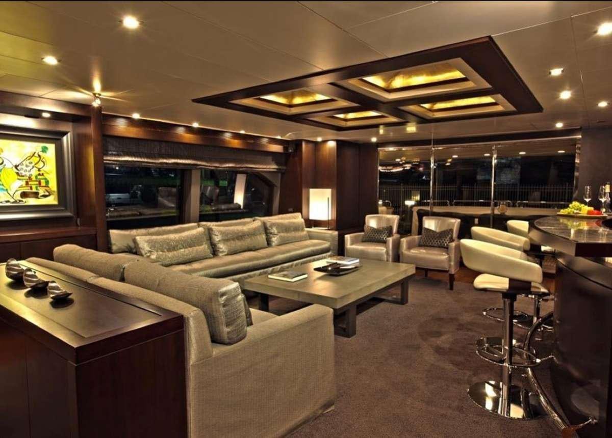 a living room with a couch and a coffee table aboard RYLAX Yacht for Charter