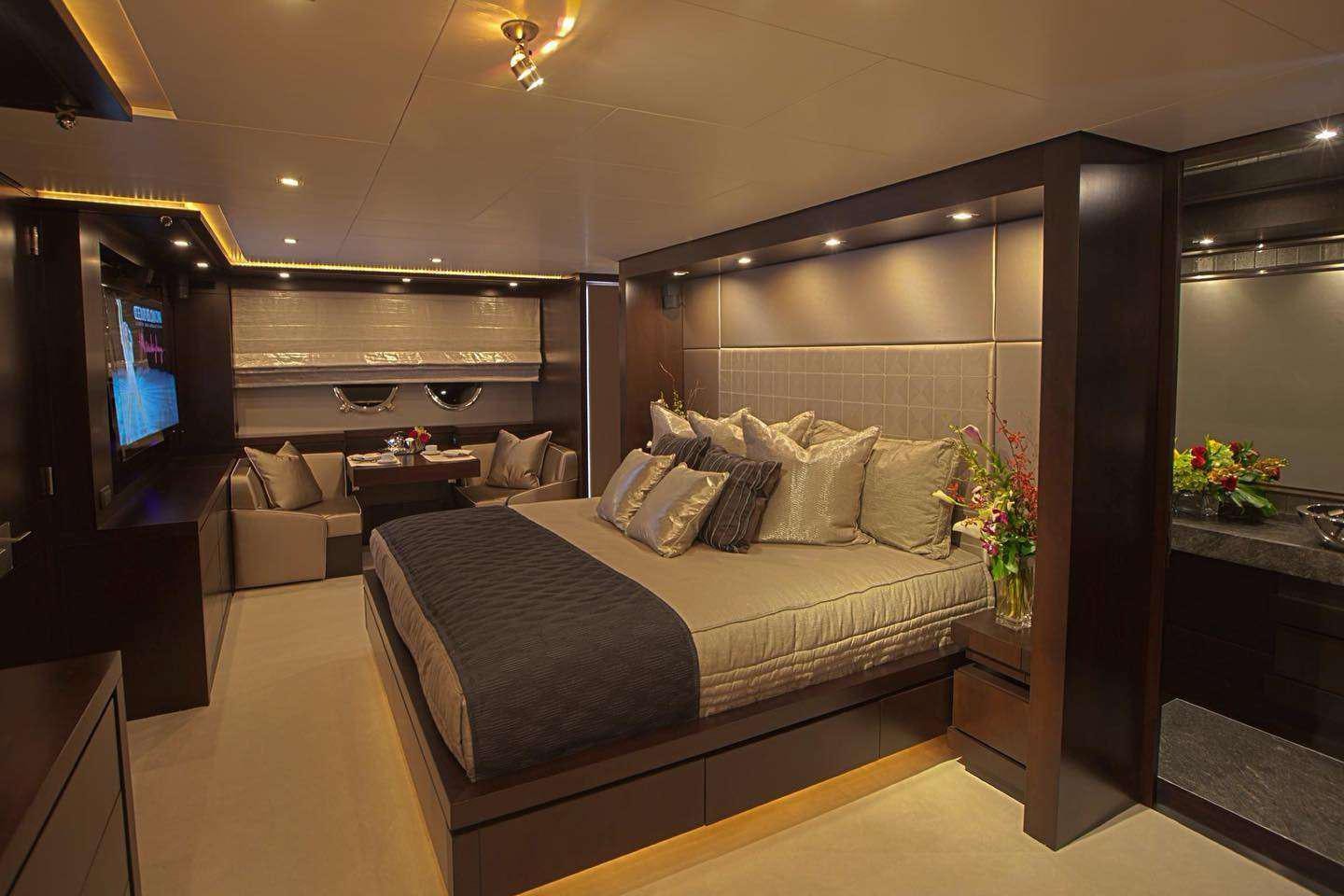 a large bedroom with a bed aboard RYLAX Yacht for Charter