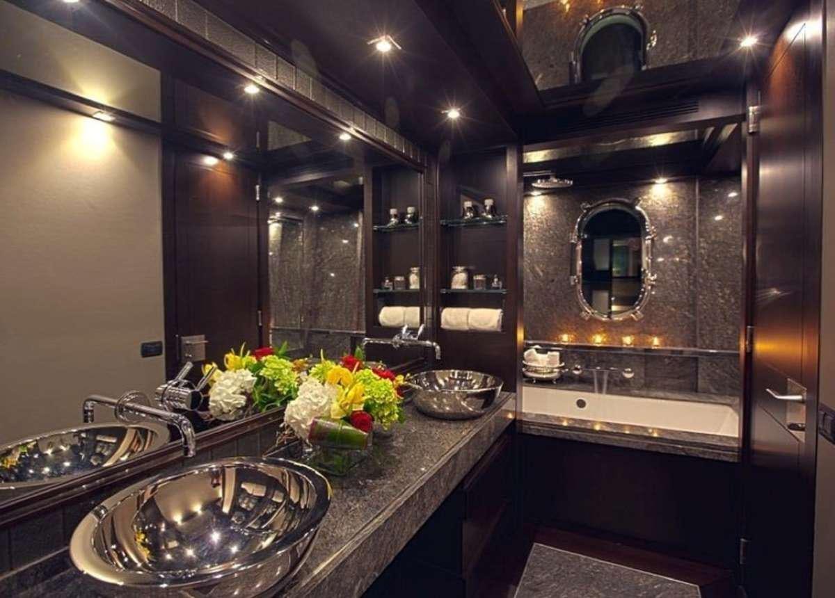a kitchen with a countertop sink and flowers aboard RYLAX Yacht for Charter