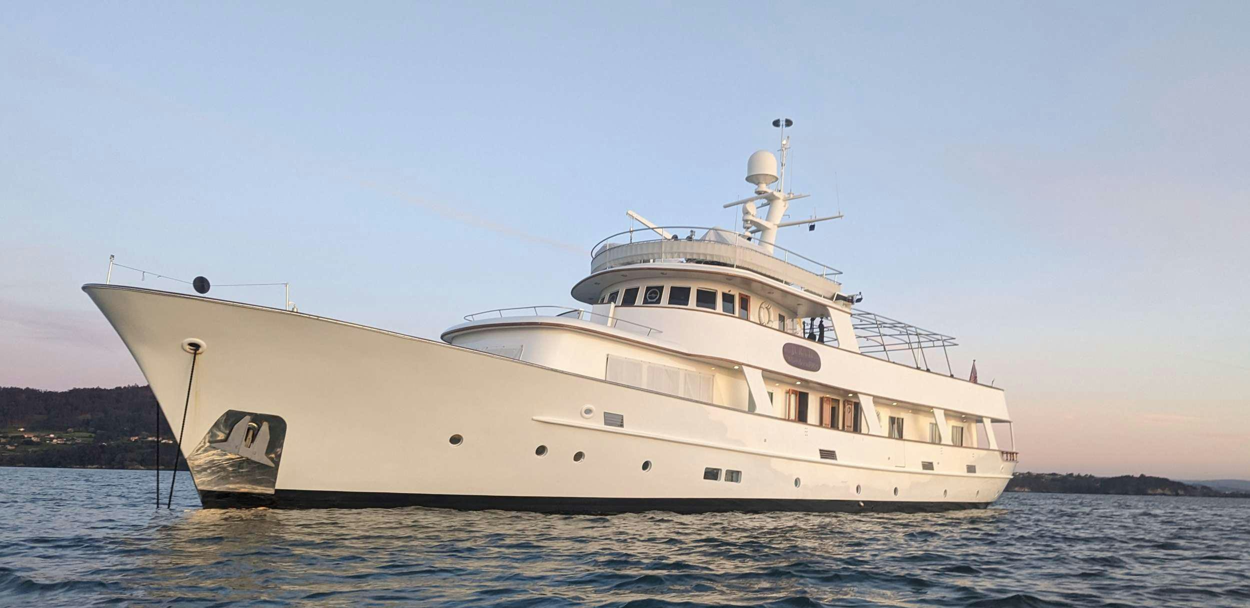 a large white ship in the water aboard JURA II Yacht for Charter