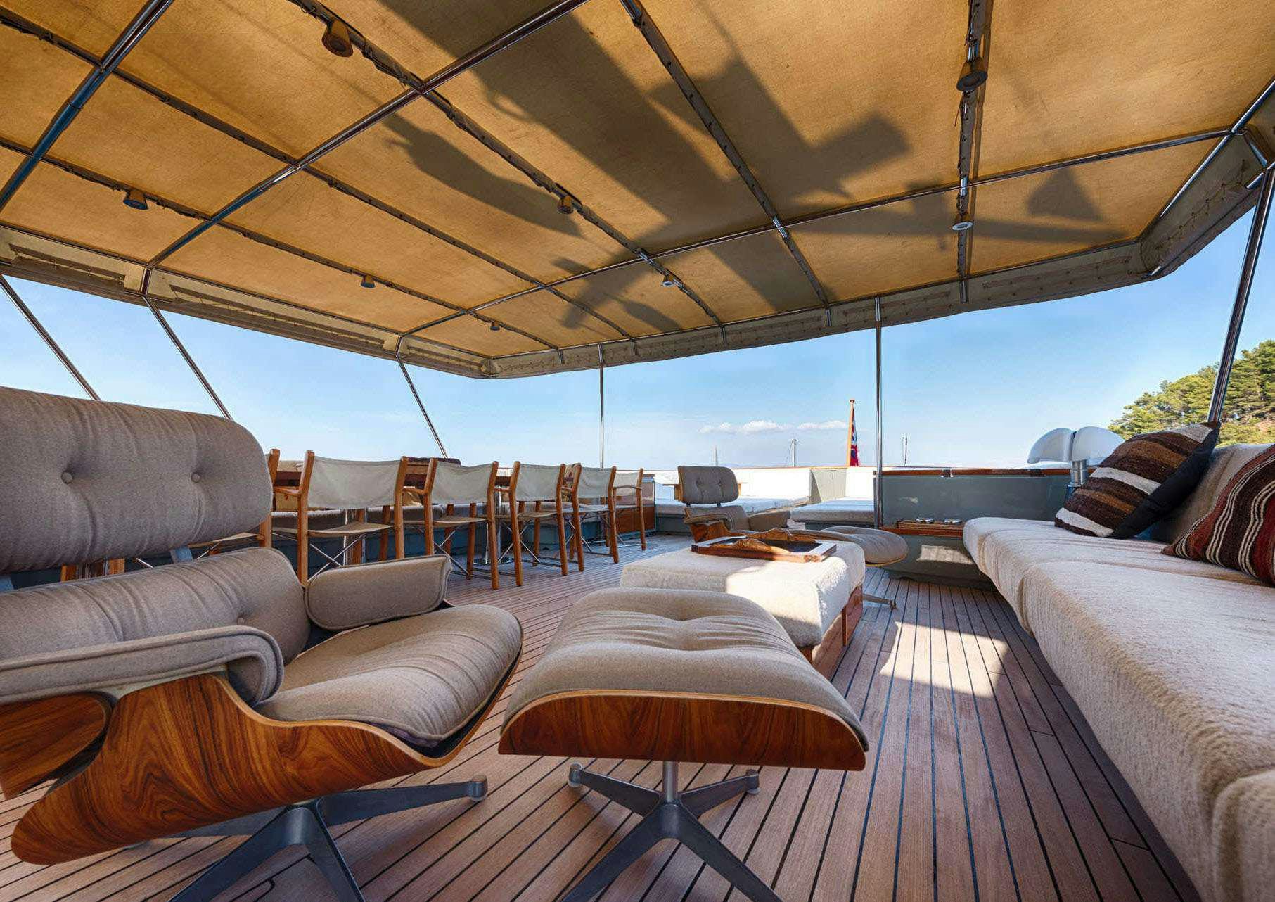 a large living room with a large patio area aboard JURA II Yacht for Charter
