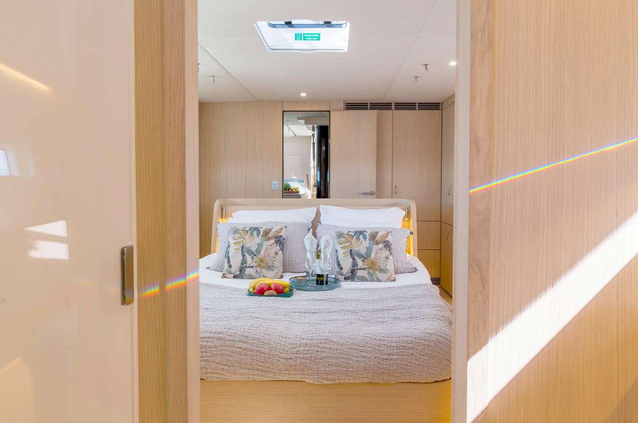 a small bedroom with a bed aboard YUME Yacht for Charter