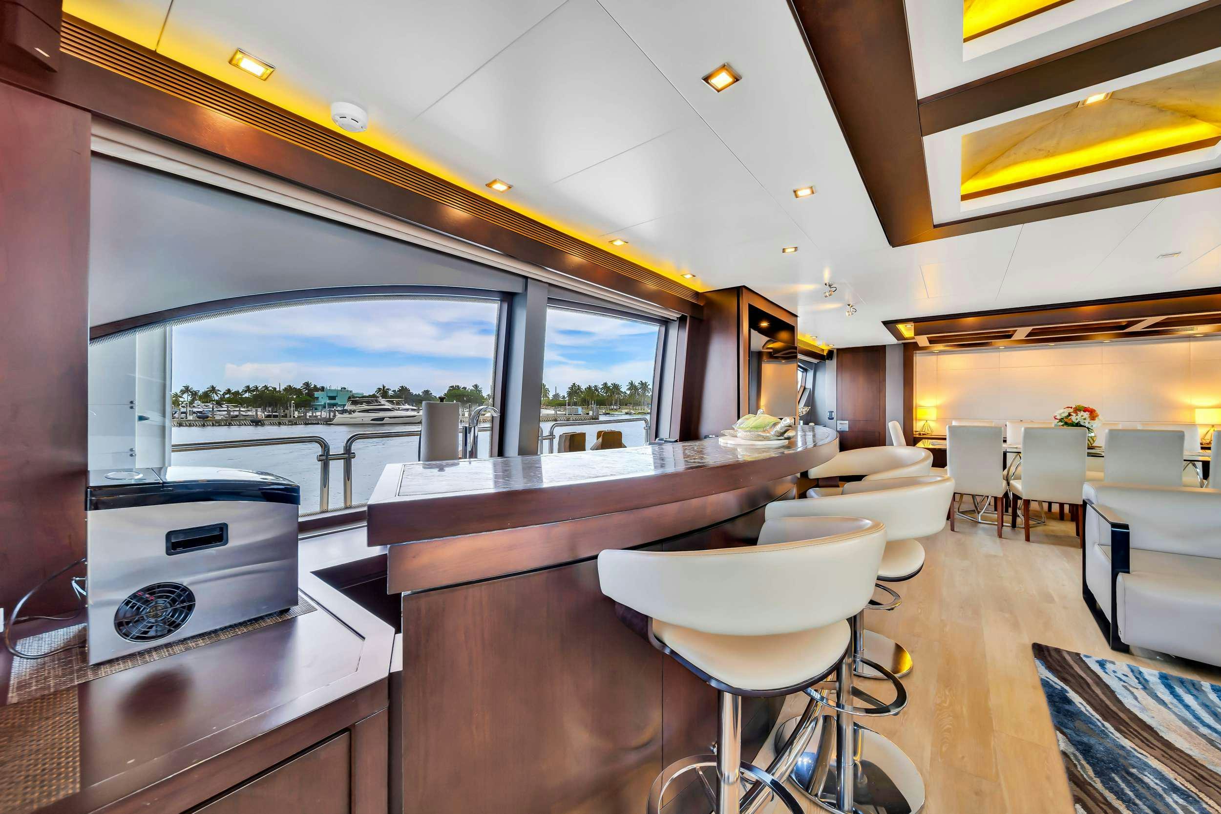 a room with a table and chairs aboard RYLAX Yacht for Charter