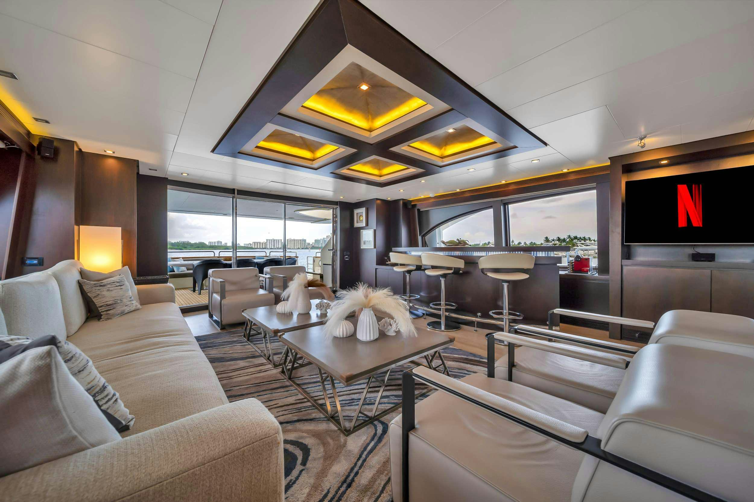 a living room with a large window aboard RYLAX Yacht for Charter