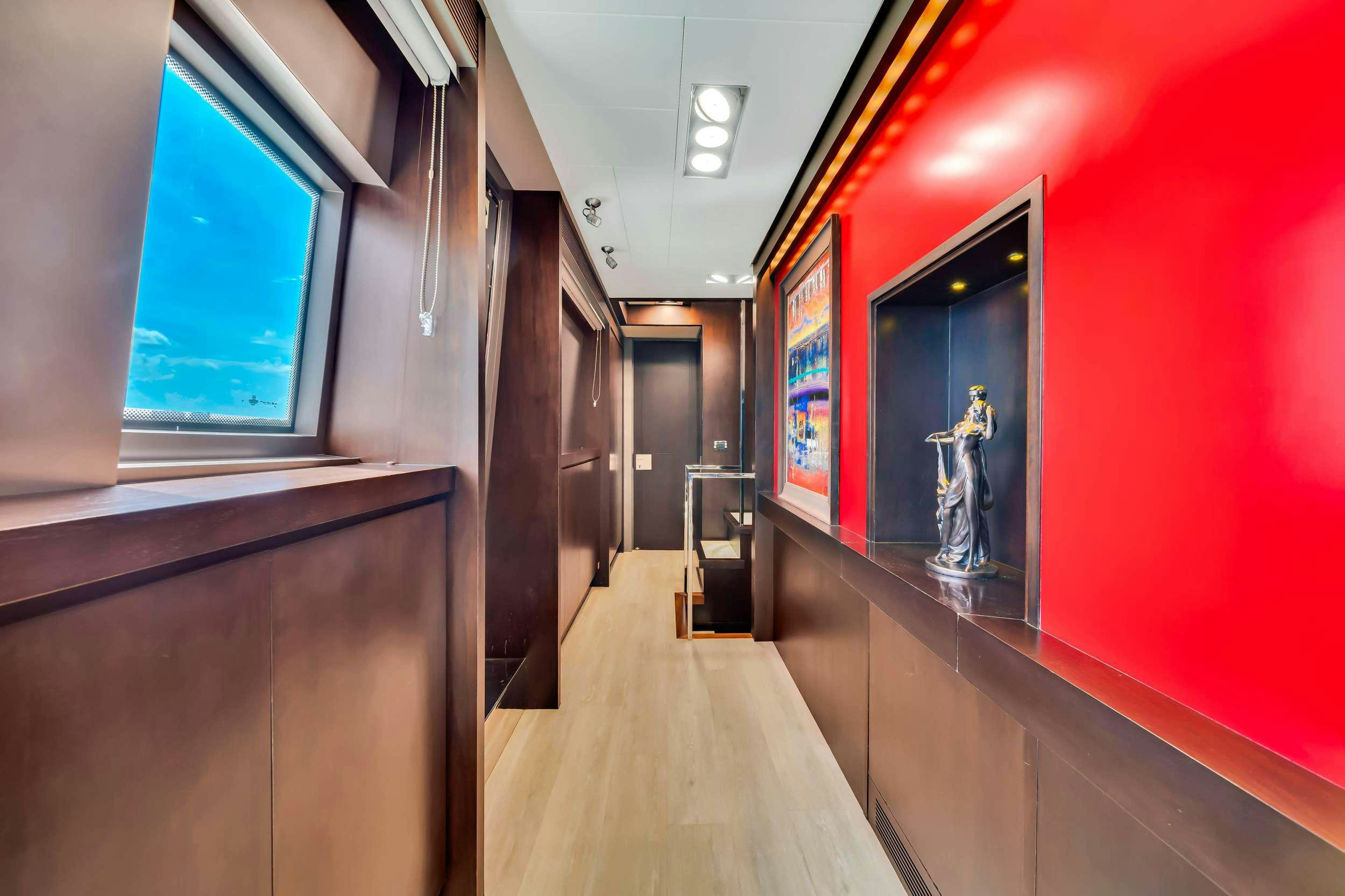 a hallway with red walls aboard RYLAX Yacht for Charter
