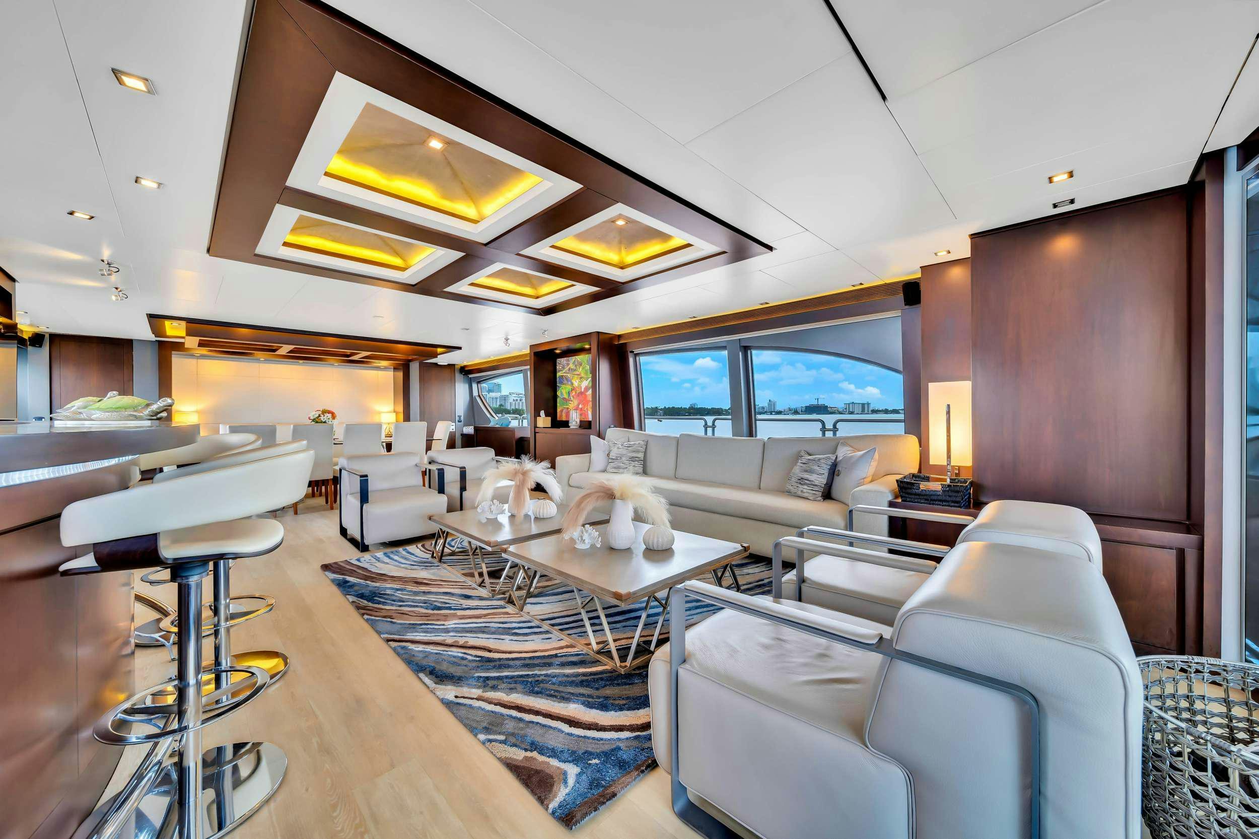 a living room with a large window aboard RYLAX Yacht for Charter