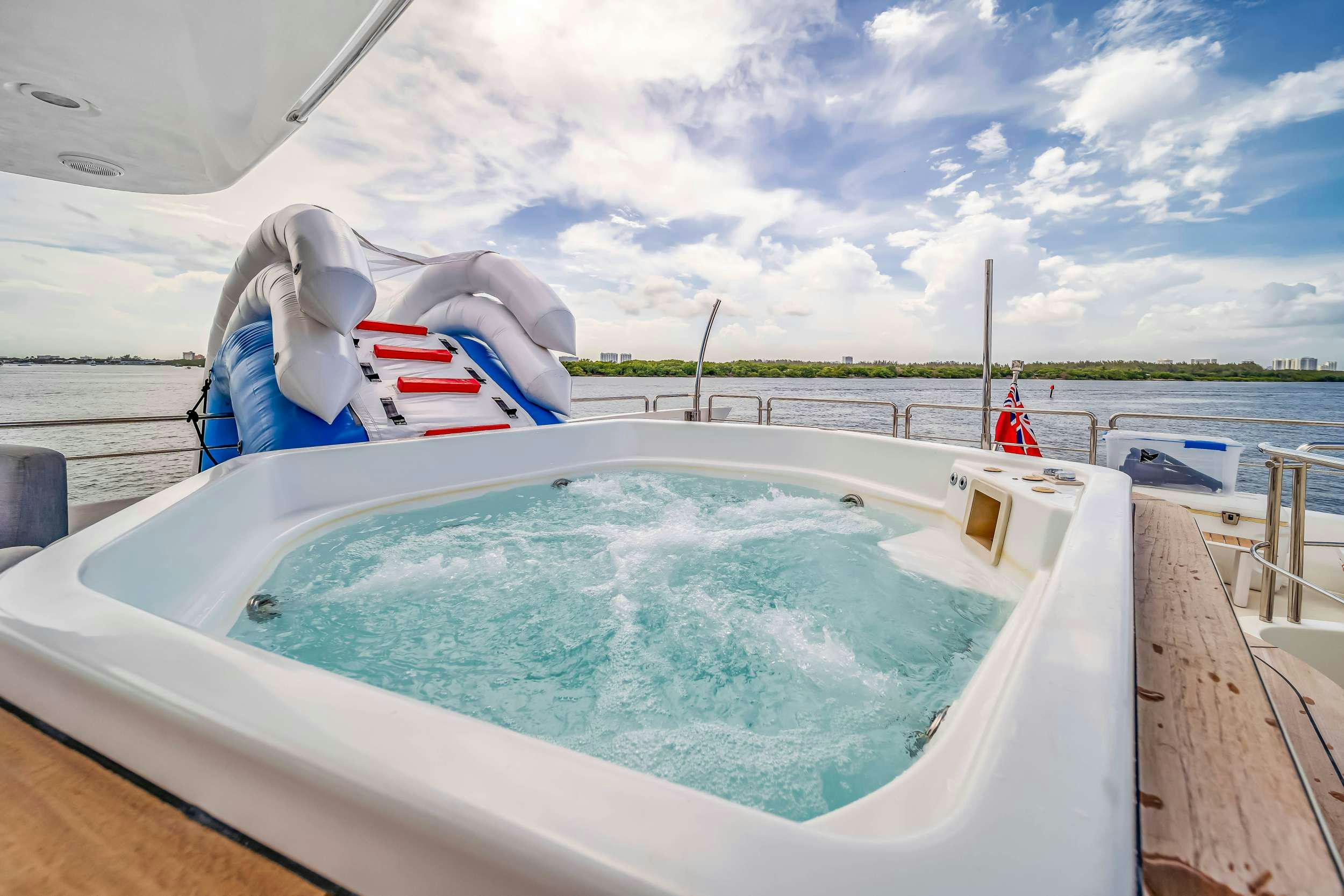 a swimming pool with a slide aboard RYLAX Yacht for Charter