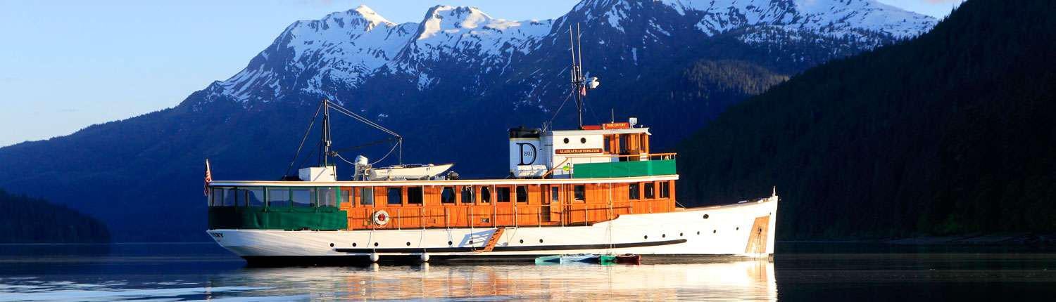 a large ship in the water aboard DISCOVERY Yacht for Charter