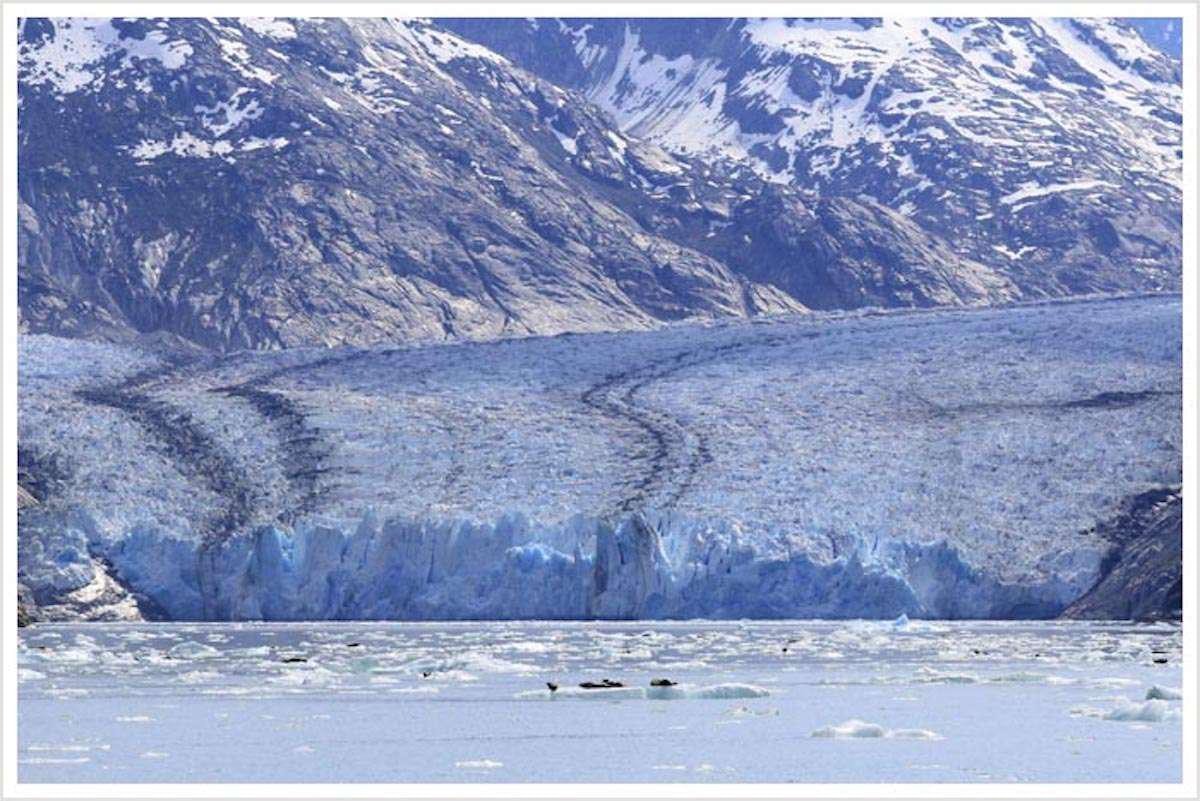 a large body of water with mountains in the background aboard DISCOVERY Yacht for Charter