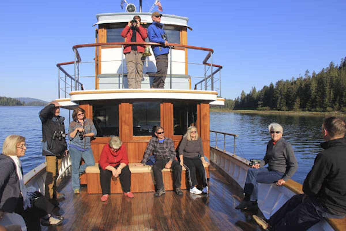 a group of people on a boat aboard DISCOVERY Yacht for Charter